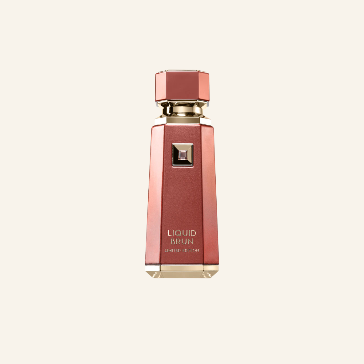 A faceted metallic rose gold perfume bottle with gold lettering that reads 'LIQUID BIRUN' and 'LIMITED EDITION' on a light cream background.