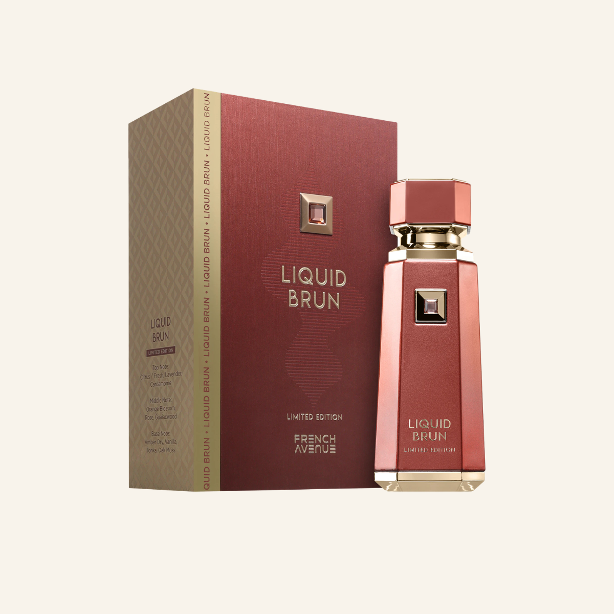 Liquid Brun perfume bottle and its matching box by French Avenue, featuring a metallic rose gold and deep red design with gold accents, set against a solid cream background.