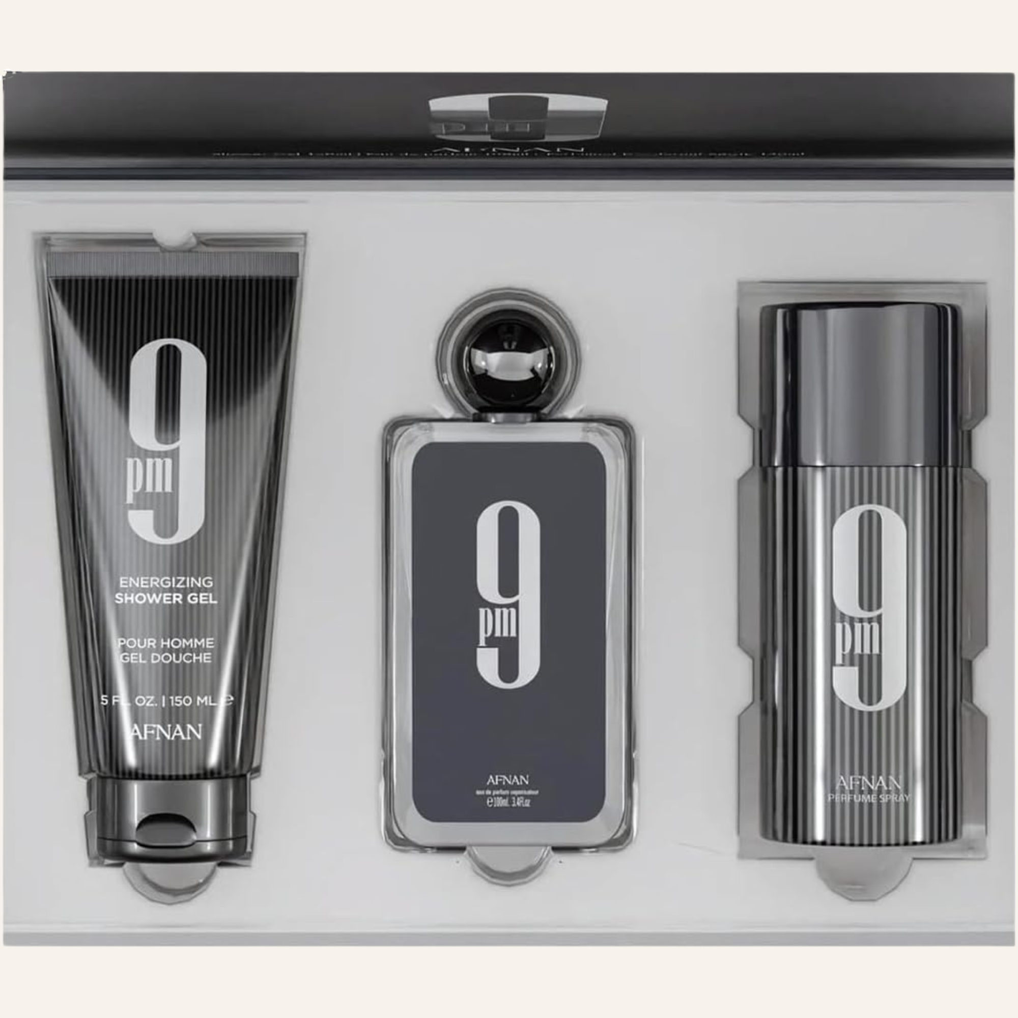 A three-piece AFNAN PM9 Energizing Shower Gel set in a sleek black and silver presentation box. The set includes a shower gel tube, a rectangular spray bottle, and a cylindrical bottle, all featuring the signature '9 pm' logo.
