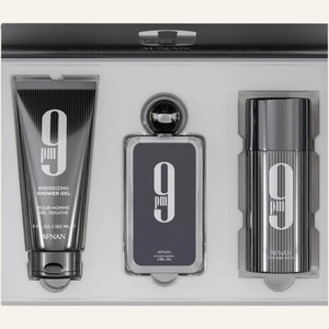 A three-piece AFNAN PM9 Energizing Shower Gel set in a sleek black and silver presentation box. The set includes a shower gel tube, a rectangular spray bottle, and a cylindrical bottle, all featuring the signature '9 pm' logo.