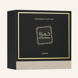 A square black fragrance gift set box with gold foil border and text reading 'FRAGRANCE GIFT SET' and 'Khamrah', plus the brand name 'Latafa' near the bottom. The front panel has Arabic lettering, and the lower section shows a light woodgrain texture.