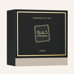 A square black fragrance gift set box with gold foil border and text reading 'FRAGRANCE GIFT SET' and 'Khamrah', plus the brand name 'Latafa' near the bottom. The front panel has Arabic lettering, and the lower section shows a light woodgrain texture.