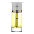 A bottle of Kashmir Musk perfume with a clear glass body showing pale yellow liquid, topped with a silver cap and gold lettering.
