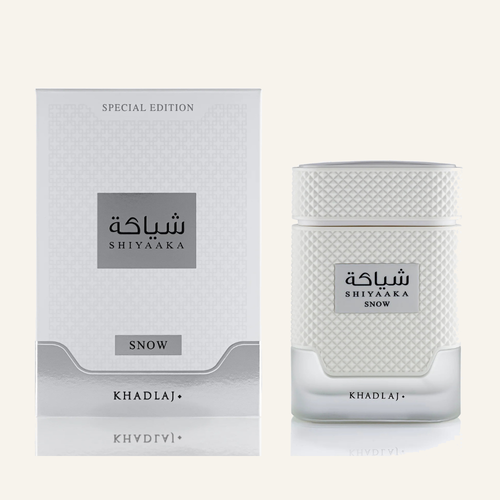 Khadlaj Shiyaaka Snow EDP 100ml bottle, Dubai Oud background #f7f3ec